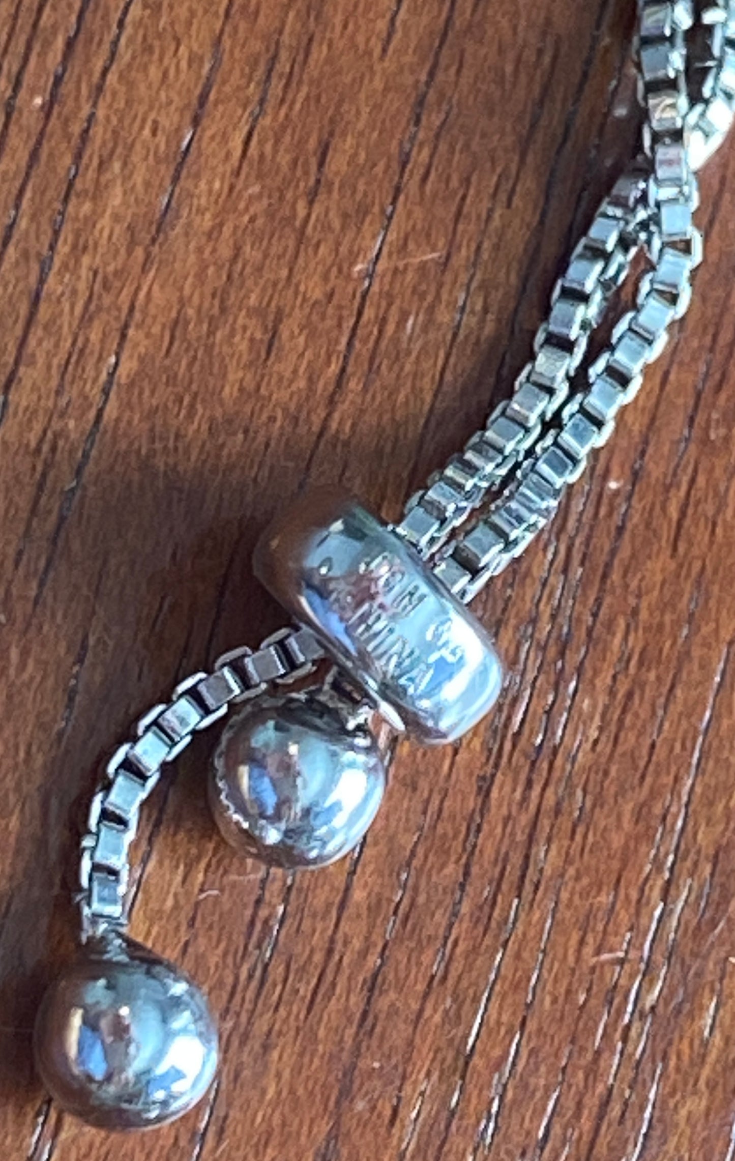 JCM Cubic Zirconia Silver Tone Metal Adjustable Slide Tennis Bracelet