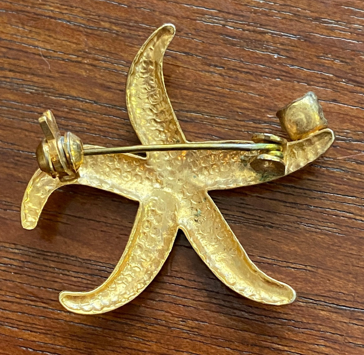 Gold Tone Metal Starfish with CZ Accent Brooch Pin