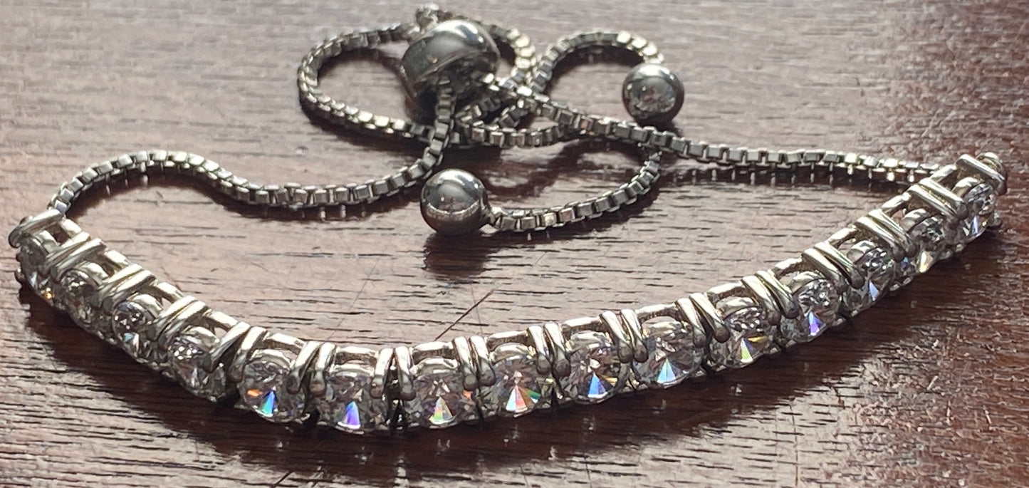 JCM Cubic Zirconia Silver Tone Metal Adjustable Slide Tennis Bracelet