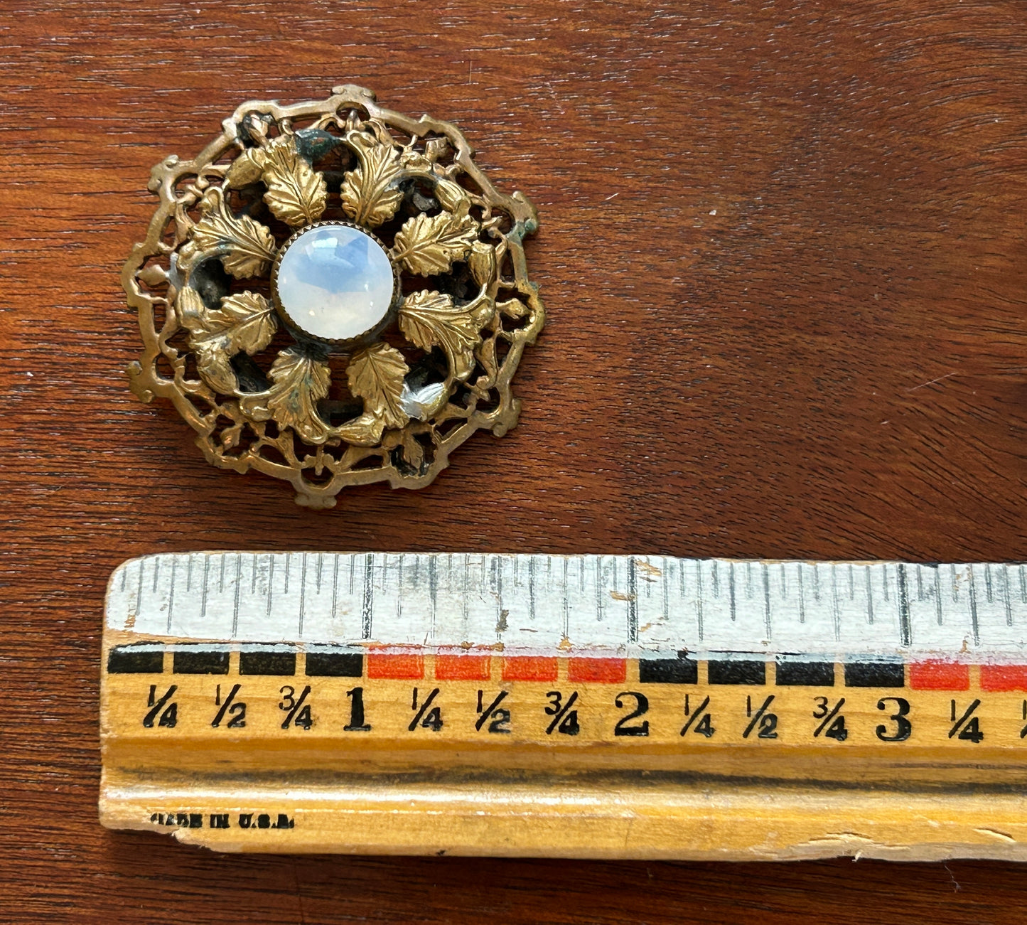 Vintage Round Filigree Gold Tone Brooch With Clear Milky Cabochon Stone