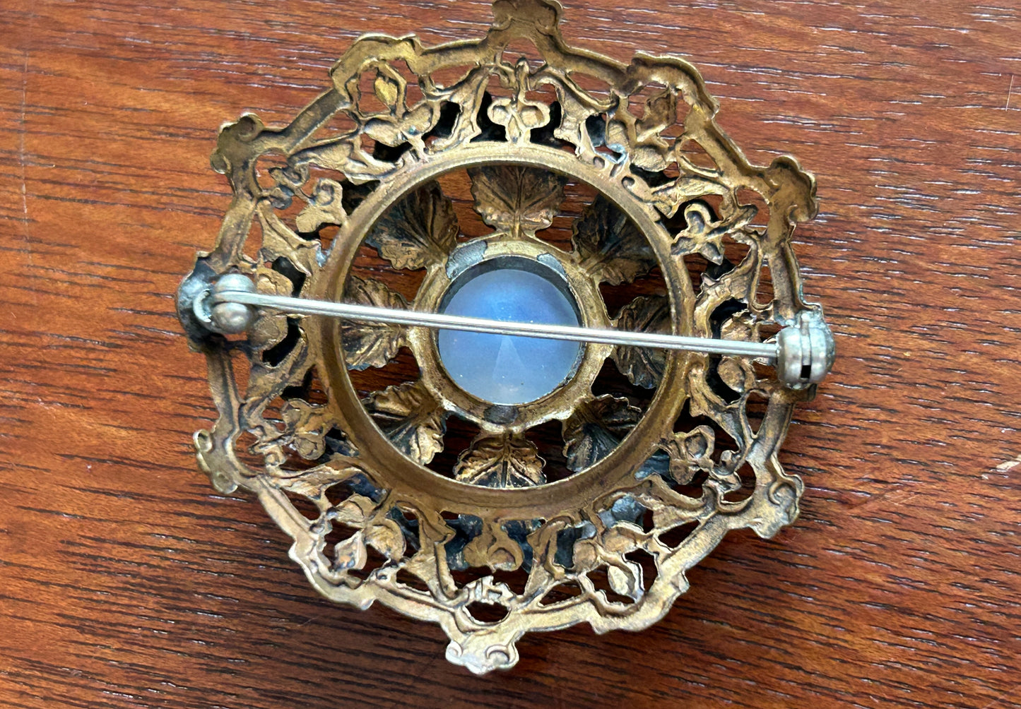 Vintage Round Filigree Gold Tone Brooch With Clear Milky Cabochon Stone