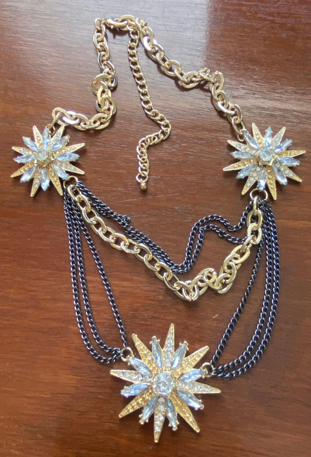 Festoon Gunmetal Gold Tone Metal Rhinestone Starburst Necklace